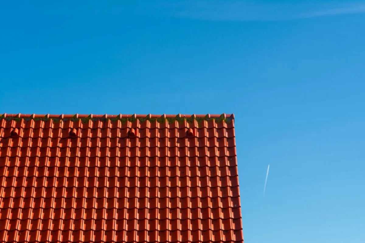 Tile roof gable in full sun, the kind of exposure that sets roof life in Carrollton, TX